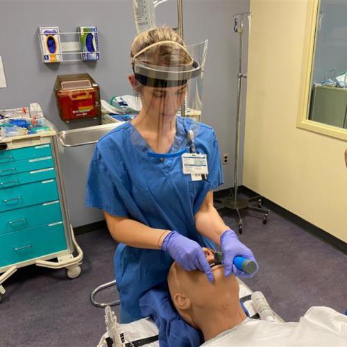 CRNA Student Testing Face Shield in OR Simulation CRNA Student Testing Face Shield in OR Simulation