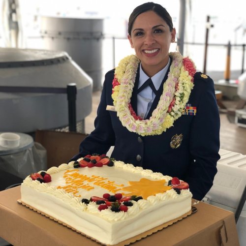 maritza ruiz with cake and lei